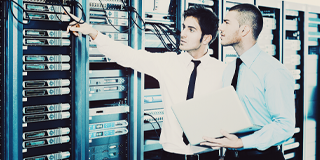 Male co-workers in server room